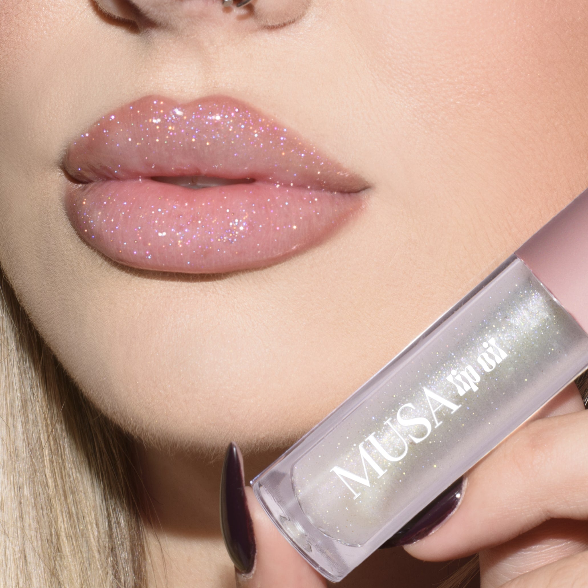 Lips with clear lip oil and holographic glitter.
