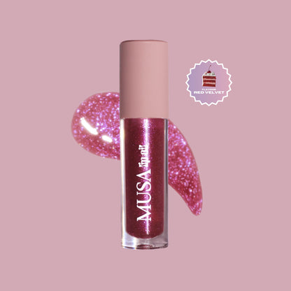 Dark pink glitter lip oil with purple glitter and red velvet scent.#color_red-velvet