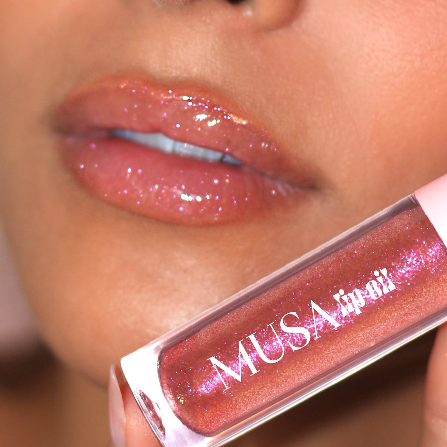 Lips with clear lip oil and purple glitter.#color_siren