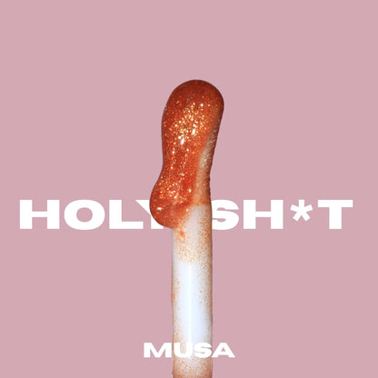 Soft and big applicator of a gold glitter lip oil from Musa. Glitter Makeup.#color_muse